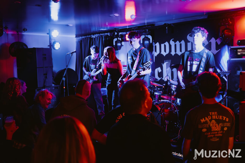 Rock Band, Superficial playing live on stage with colourful lights