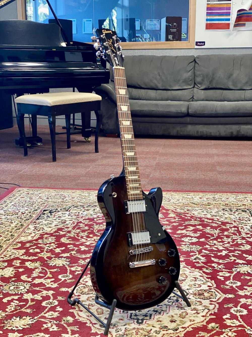 Rock Band Powder Chutes Donates A Gibson Les Paul To Mount Aspiring College